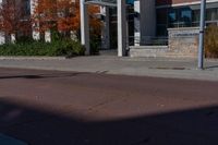 an empty street with a sign that says to not ride on it and a no parking sign