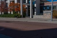 an empty street with a sign that says to not ride on it and a no parking sign