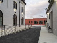 a long building with several windows along the side of it and a ramp going up to it