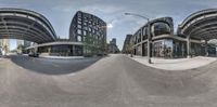 the distorted image shows the view of the street from a different angle on a fish eye lens