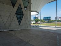 this is a long brick pathway with many walkways in front of it and benches on either side