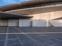 the white walls of the building are clad with wood panels and studdings that make it look like a wall