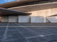 the white walls of the building are clad with wood panels and studdings that make it look like a wall