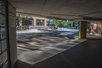 the sun is reflecting in the parking spaces near a sidewalk area with two benches on it