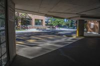 the sun is reflecting in the parking spaces near a sidewalk area with two benches on it