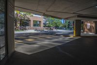 the sun is reflecting in the parking spaces near a sidewalk area with two benches on it