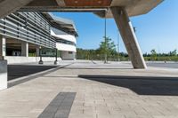 empty concrete walkway with no people sitting outside of it and trees around the area outside