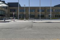 a fire hydrant sitting in front of a large building filled with flags and american flags