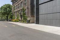 a woman riding her bike down the sidewalk in front of a building that has lots of doors on the side