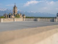 several large empty parking spaces in the city with buildings nearby in front of them -