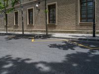 the side walk and walkway of a building is marked with markings for parking spaces below