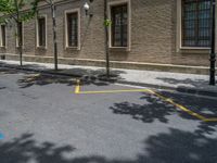 the side walk and walkway of a building is marked with markings for parking spaces below