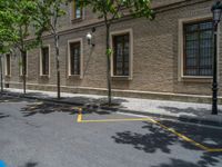 the side walk and walkway of a building is marked with markings for parking spaces below