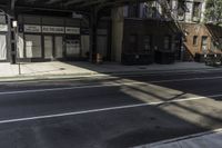 Urban Design: A Window View of a Building and Asphalt Road