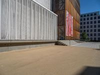 a group of people riding skateboards near wooden panels and stairss with artwork on them