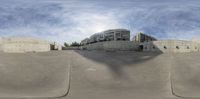 the view of a skate park, as seen from a side angle with no one riding