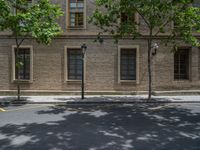 the side walk and walkway of a building is marked with markings for parking spaces below