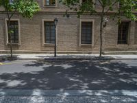 the side walk and walkway of a building is marked with markings for parking spaces below