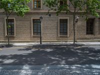 the side walk and walkway of a building is marked with markings for parking spaces below