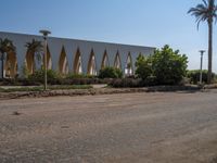 Urban Egypt: Clear Sky, Palm Trees, and Architecture