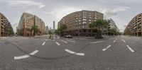 a view of a empty street from a fisheye lens while people walk on the street