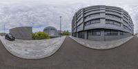 three spherical angles showing a car in front of a building and another street corner in the same direction