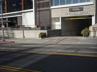 there is an outside view of the city building with a traffic light on the curb