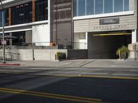 there is an outside view of the city building with a traffic light on the curb