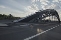car going through the bridge with no traffic on it's track, in motion