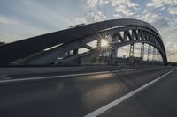 car going through the bridge with no traffic on it's track, in motion
