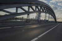 car going through the bridge with no traffic on it's track, in motion