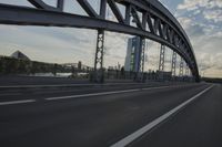 car going through the bridge with no traffic on it's track, in motion