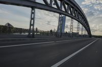 car going through the bridge with no traffic on it's track, in motion