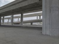 the street is lined with columns and concrete pillars that line all sides of the road