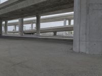 the street is lined with columns and concrete pillars that line all sides of the road