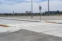 a view of an intersection with the sky in the background and the signs to both sides of the street