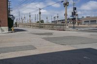 a police car is stopped at the intersection of a street that leads to the bridge