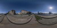 panoramas of two buildings with the reflection of a skateboarder doing a trick