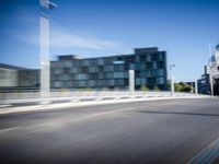 a city street with buildings near by with motion blurrs and a blurred street corner