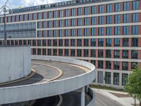 a car is driving on the highway through an underground parking garage area in a city