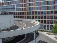 a car is driving on the highway through an underground parking garage area in a city