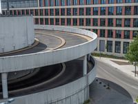 a car is driving on the highway through an underground parking garage area in a city