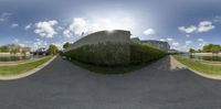 the 360 - view shows how the building is placed in a curve shape with a garden next to it