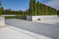 the concrete planters in the foreground is designed to look like they are walking along