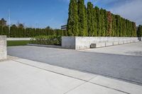the concrete planters in the foreground is designed to look like they are walking along