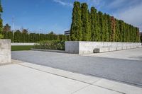 the concrete planters in the foreground is designed to look like they are walking along
