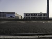 parking spaces with cars and buildings in background at sunset or sunrise or sunrise with the sun rising