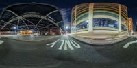 two circular panoramas with the names of two streets, taken in an image captured at night