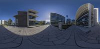 a 360 - view image taken of the outside of a building with two different buildings in front of it