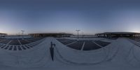 this is an 360 - lens image of some benches at a park or an outdoor mall